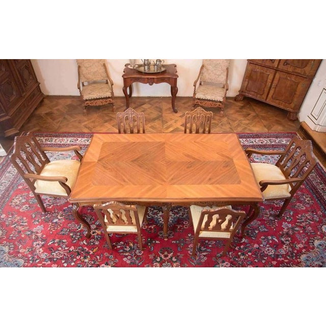 Spacious dining table in the Louis XV rococo style. The top is decorated with mirror-folded veneer, rich edge profiling...
