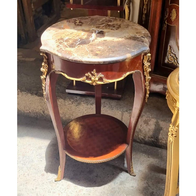 Introduce timeless French sophistication into your home with this exquisite Louis XVI-inspired side table, masterfully...
