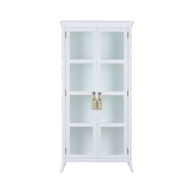 Nights in White Linen cabinet is crafted of wood and features a stylish bamboo design with a white finish. Two clear glass...