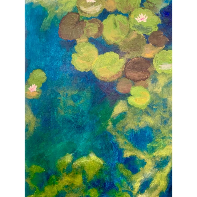 Impressionist style painting in rich, jewel tones of a reflecting pond with water lilies. Acrylic on gallery wrapped canvas.