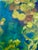 Impressionist style painting in rich, jewel tones of a reflecting pond with water lilies. Acrylic on gallery wrapped canvas.