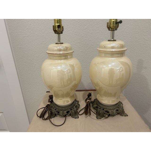 Chinoiserie Style ceramic Ginger Jar Table Lamps. Beautiful pale yellow opalescent lamp body complimented with detailed...