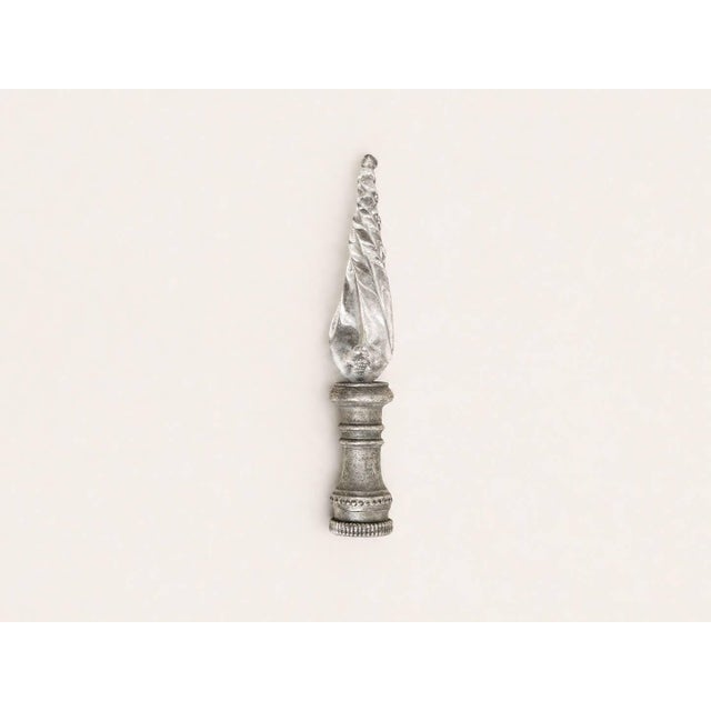 A beautifully sculptural antique cut glass lamp finial featuring a twisted, flame-form silhouette paired with an...