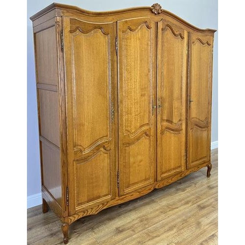 This elegant Vintage French Louis wardrobe showcases refined craftsmanship and timeless appeal, featuring beautifully...