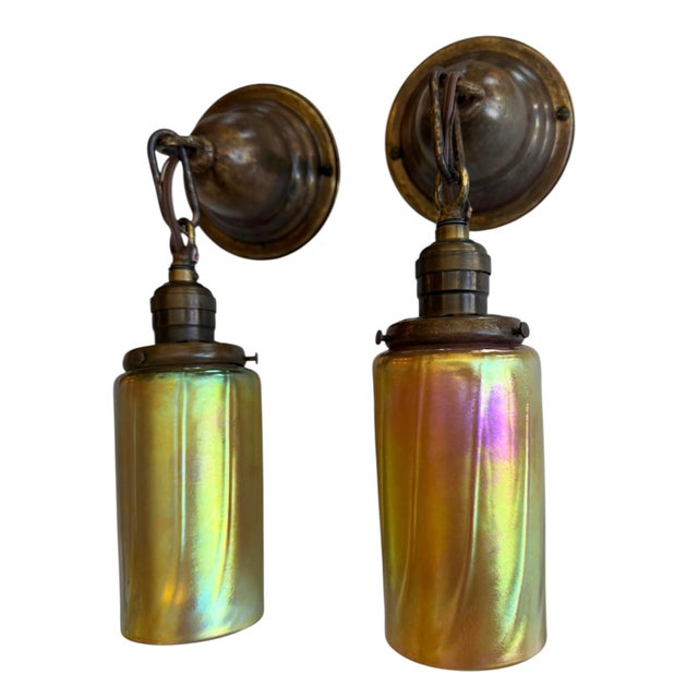 A rare pair of vintage signed art glass wall sconces from Lundberg Studios. These can also be hung as ceiling pendants as...