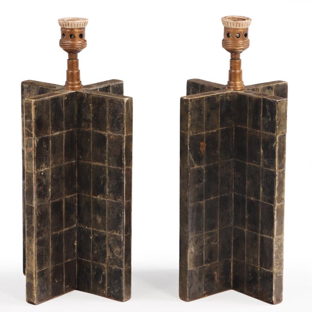 A pair of striking lamp bases of cruciform form, entirely clad in a meticulously arranged patchwork of natural mica...