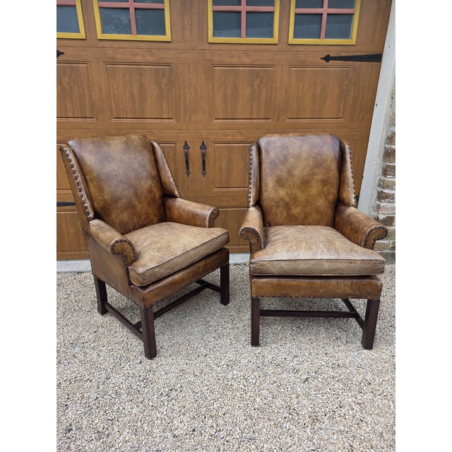 Beautiful pair of distressed rugged leather Armchairs by Henredon. These have a date of 2001 on a label.