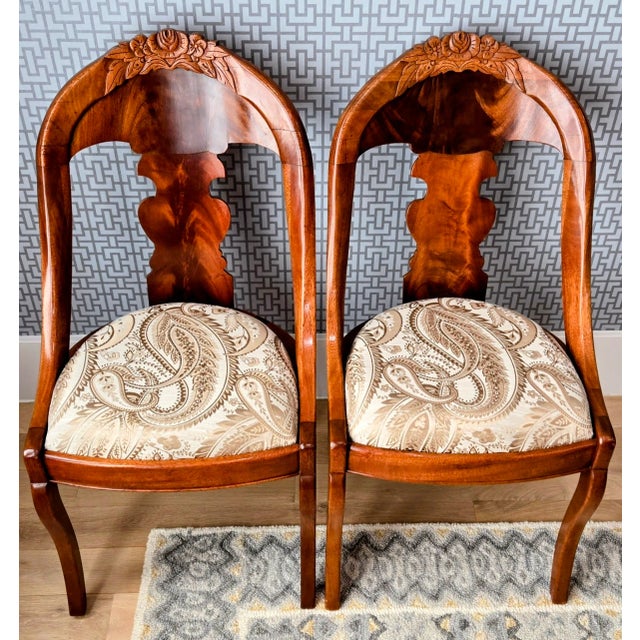 This exquisite pair of 19th-century side chairs beautifully represents Philadelphia’s Rococo Revival period, circa 1845....