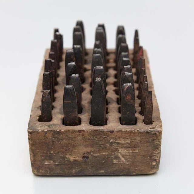 Surrealist sculpture, punch engraving by Adrian Iron and wood 2017.