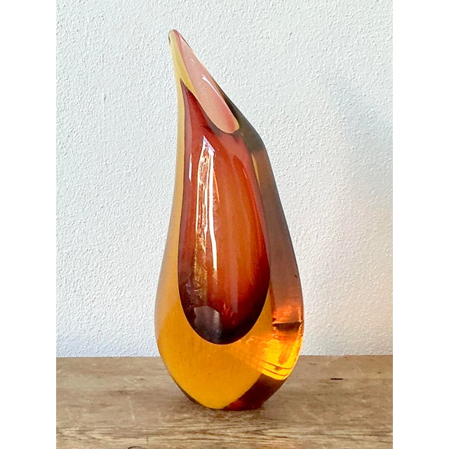 This striking vintage Murano glass vase is a masterful example of the iconic "Sommerso" technique, where multiple layers...