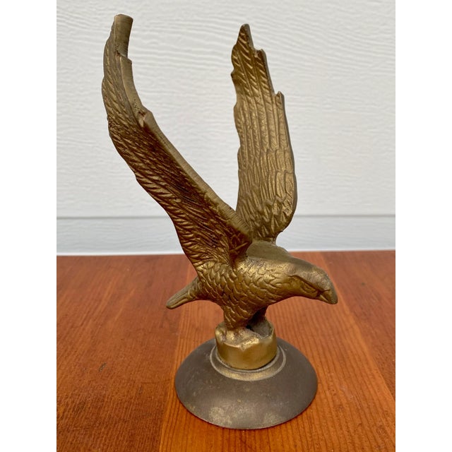 Vintage Solid Cast Brass Eagle with outstretched wings. It has some tarnishing, due to age and wear.