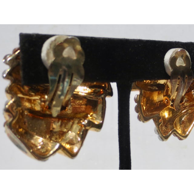 Gold and silver rhinestones in a tiered design. Gilt metal with clip-on attachments