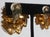 Gold and silver rhinestones in a tiered design. Gilt metal with clip-on attachments