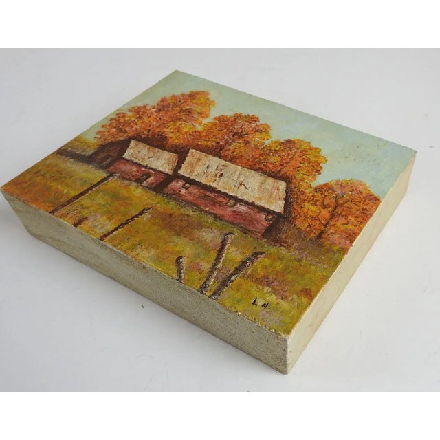 Small mid 20th century oil on solid block of wood red barn in autumn landscape painting by Lil Alterman. Signed L. A....
