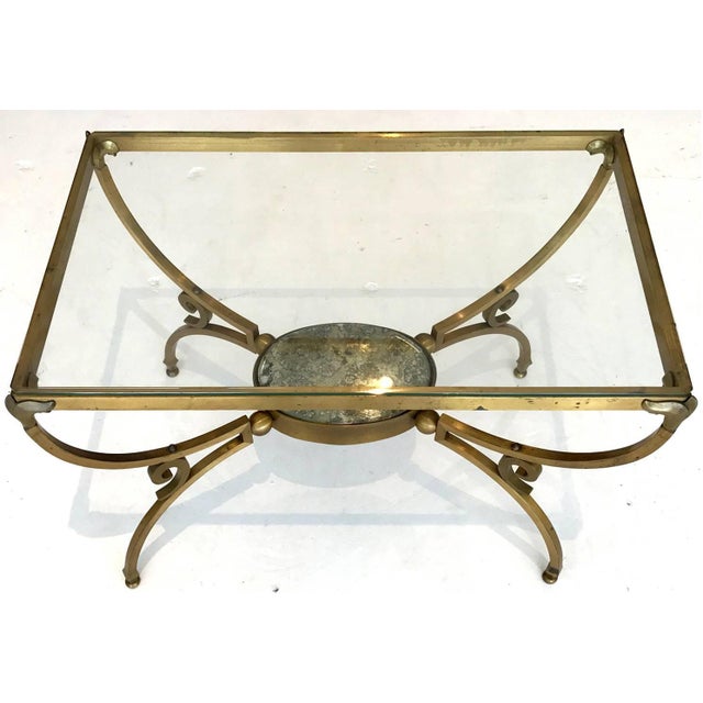 Designed by Arturo Pani and crafted by metal artisan circa 1950s, Model no 3026, these pair of bronze side table showcases...
