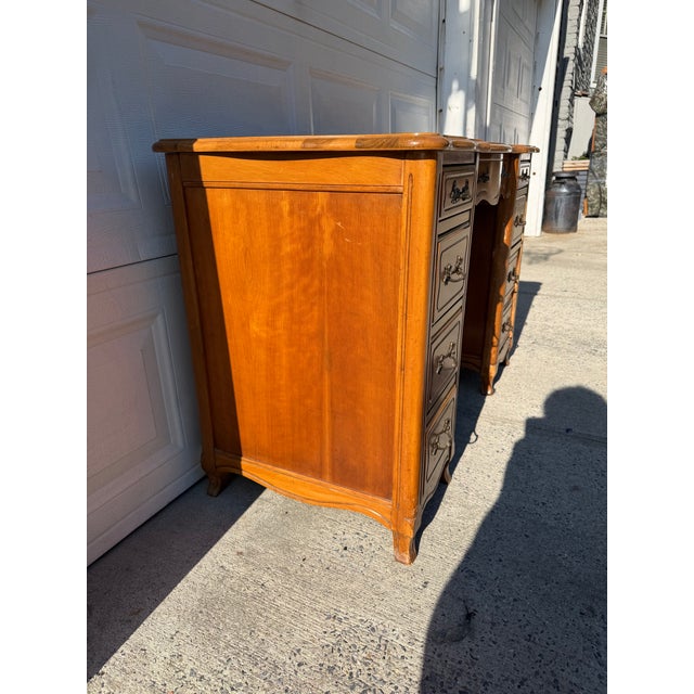 We have an absolutely stunning, vintage French Provincial writing desk for sale. It features a warm wood finish, ornate...