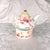 This is a teapot, lid and warming stand by Grace’s Teaware in Pink Rose Dots from 2018. But there are a couple problems...