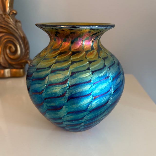 Beautiful 2024 art glass vase from Lundgerg Studios. Iridescent peacock colors in gold, blue, green, pink and copper...
