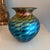 Beautiful 2024 art glass vase from Lundgerg Studios. Iridescent peacock colors in gold, blue, green, pink and copper...