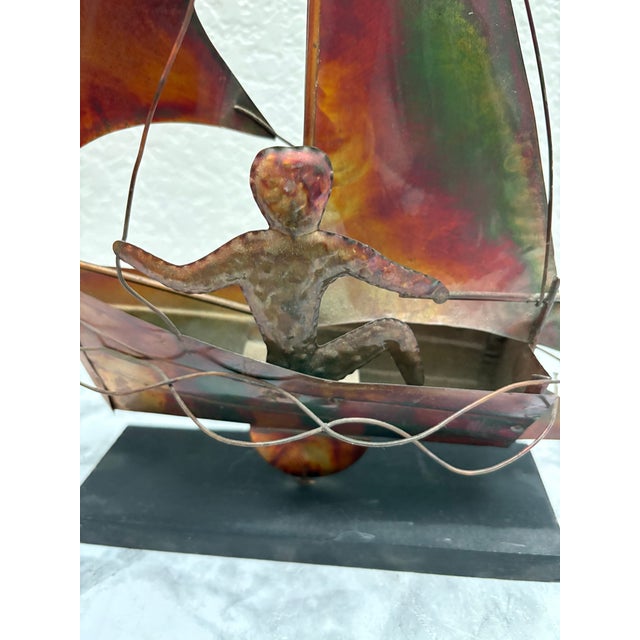 Midcentury brutalist copper sculptural sailboat. On the back behind the sails is the sailor. Intricate details and...