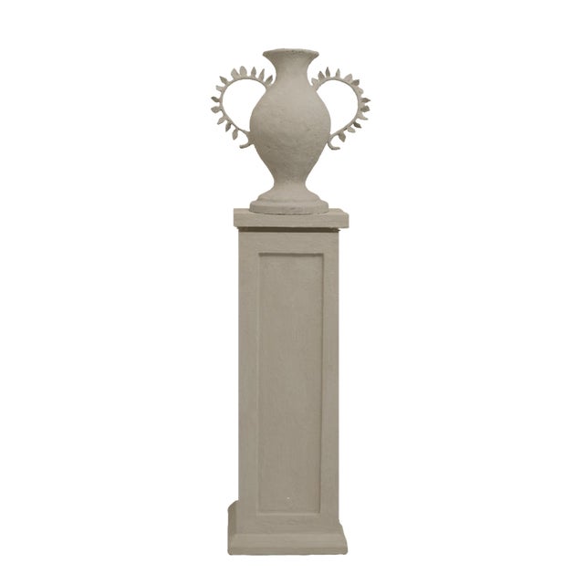 The Beata Vessel is a sculptural piece defined by texture, craftsmanship, and form. Cast in cement papier mâché and...