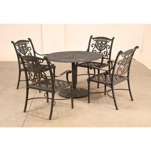 High Quality Hanamint Outdoor Round Cast Aluminum Dining Table and Chair Set. Set Features Ornate Scroll Pattern Table Top...