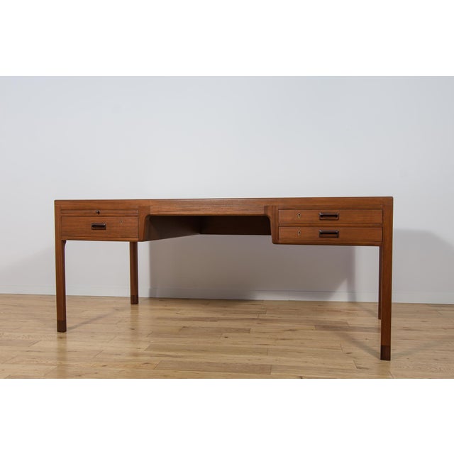 A large desk designed by Ejner Larsen and Aksel Bender Madsen for the Danish manufacturer Willy Beck in the 1950s. The...
