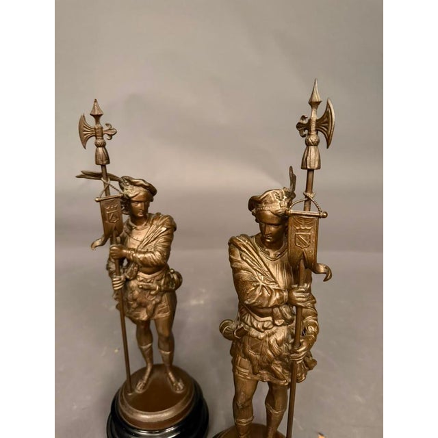Pair of 19th-century European soldier figures dating to circa 1890, finished in a rich bronze tone and presented on...
