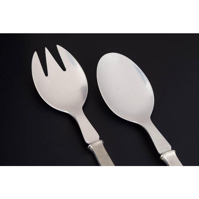 Evald Nielsen salad set. Model number 32. Elegant salad set in 830 silver and stainless steel consisting of a salad spoon...