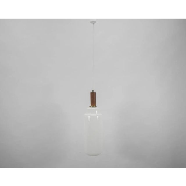 Cylindrical scandinavian opal glass hanging lamp with teak wood, 1960s the lamp can be adjusted up from 70 to 120cm...