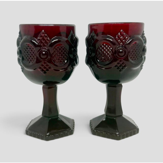 Vintage Avon 1876 Cape Cod Ruby Red Collection 4 1/2” Wine Glasses - A Pair. These are deep red pressed glassware produced...
