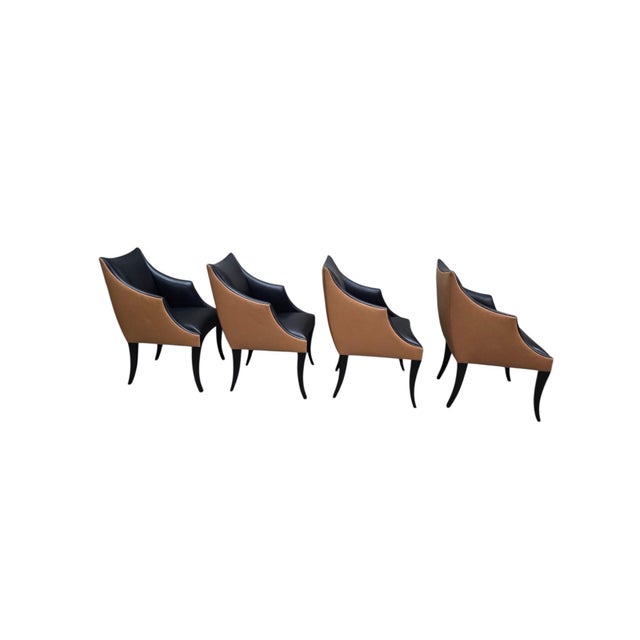 A sculptural set of four vintage armchairs by Donghia, retaining original maker’s tags. These chairs feature a refined...