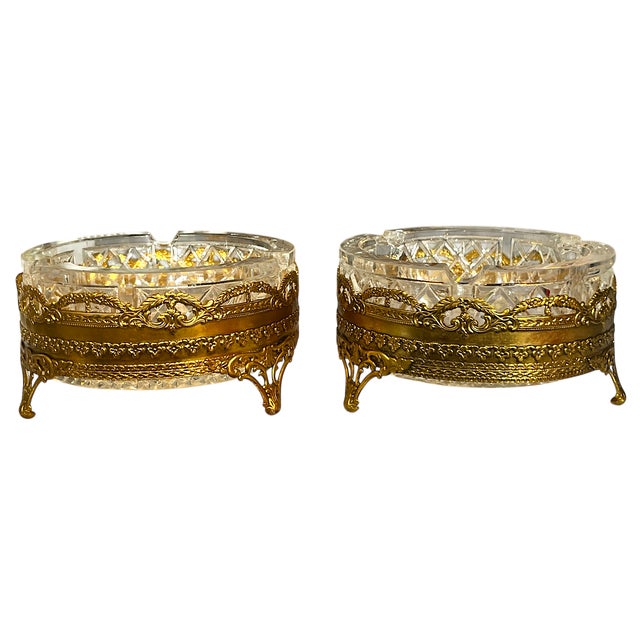 Ornate 1960s faceted glass and gold ormolu ashtray catchall. Featuring a beautifully faceted glass bowl with intricate...