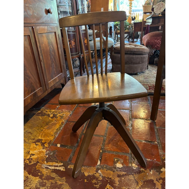 Beautiful child's roll top desk with swivel banker's style chair from the early 1900's. There are three drawers with brass...