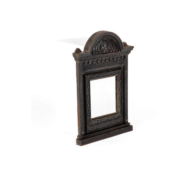 A splendid 19th century cast iron over mantle fireplace mount with the original foxed mirror plate mounted within. This...