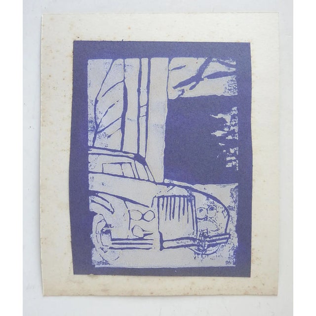 Vintage mid century lino print on bluish purple paper of a car. Unsigned. Unframed, mounted on cardboard backing, age...