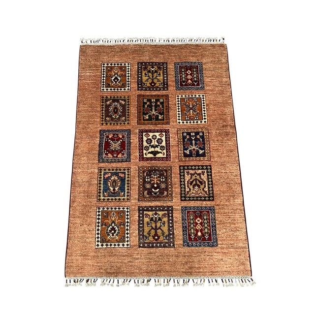 This Bakhtiari style wool rug brings the Persian Four Seasons design into a compact accent size. Fifteen framed panels of...
