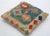 A one-of-a-kind handwoven Afghan wool kilim accent pillow featuring vibrant zigzag diamonds in green, red, and blue. Cut...