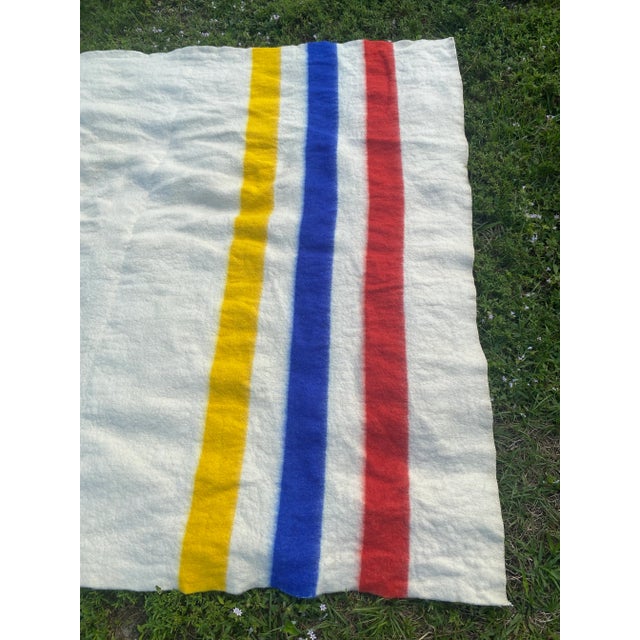 Vintage Hudson Bay Style Midcentury white with Red, Blue, and Yellow Striped Wool Blanket- in excellent vintage condition....