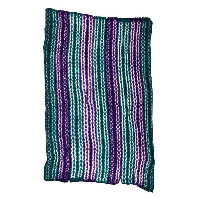 The markings on Adire Eleko textiles often appear more hand-drawn than their stitch-and-tie-resist relatives, and that's...