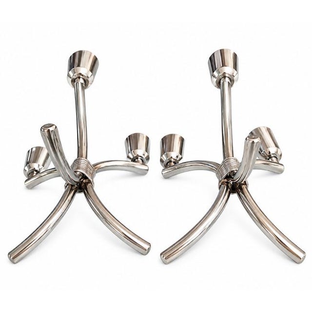 Pair of Rogers Bros Flair candleholders. Circa 1950's. Height 7", arm spread 4 1/2". Silver handle holds. Appraised in...