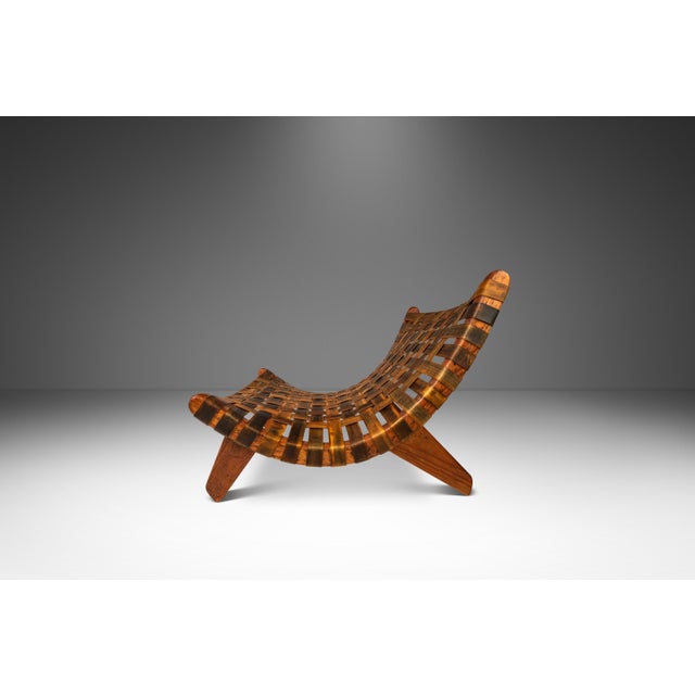 Introducing a truly one-of-a-kind scoop chair built in the manner of José Zanine Caldas. Built from a frame of solid...