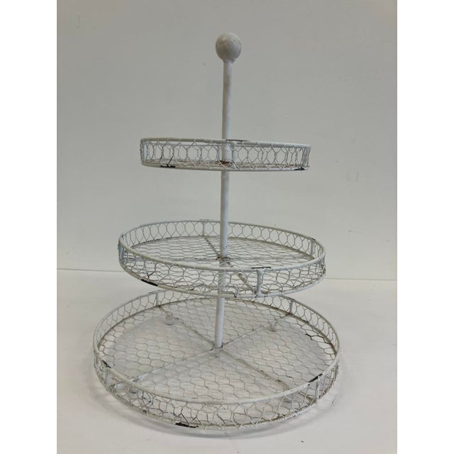 This vintage 3-tier wire basket stand is a charming farmhouse-style piece, perfect for adding rustic organization and...