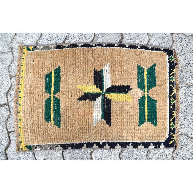 This is a vintage Turkish Oushak rug from the 1960s. The piece was hand-knotted.