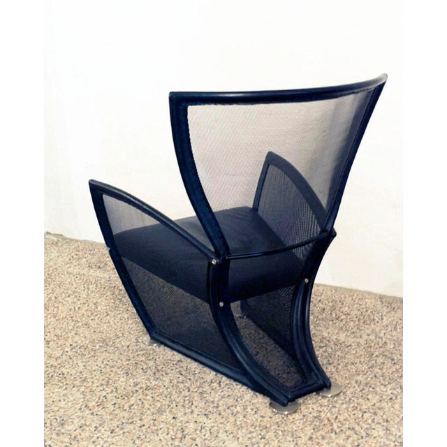 Privé armchair and footrest designed by Paolo Nava and produced by Alias in the 1980s. The structure is made of tubular...