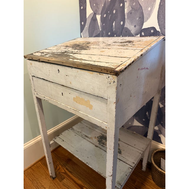 An exceptional antique primitive merchant’s counter featuring a beautifully weathered original white painted finish, a...