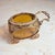 A charming antique jewelry casket in the form of a miniature carriage or pram, hand-finished in gilt brass with fine...