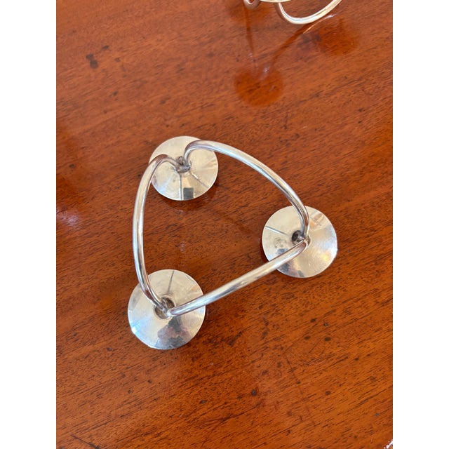 A striking pair of sculptural mid-century modern candelabras crafted in Denmark by Berg. Each silver-plated piece features...