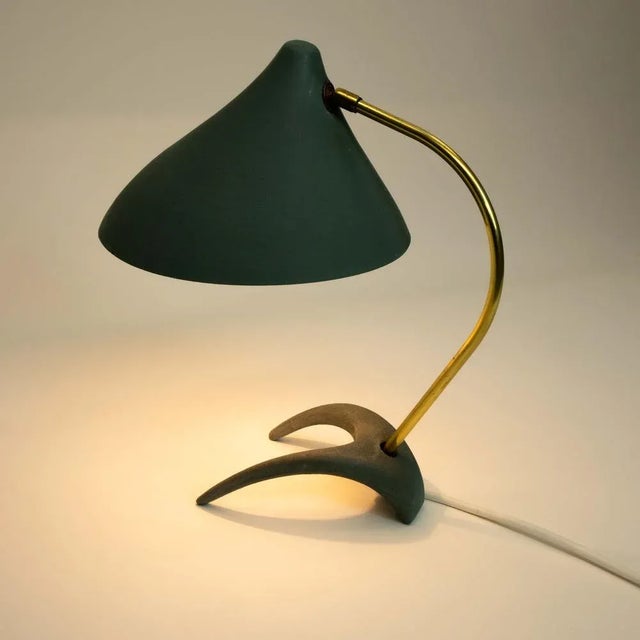 The crow's foot table lamp of the designer Karl Heinz Kinsky decorates every room with its elegant and particularly...