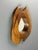 Sculptural wall mirror from France, 1960s, with a freeform carved wood frame. The outline is asymmetrical, with two curved...